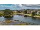 Scenic lake view surrounded by meticulously maintained condo buildings at 1318 Red Oak Ln, Port Charlotte, FL 33948