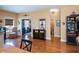 Open-plan living area with hardwood floors, providing ample space for dining and relaxation at 1318 Red Oak Ln, Port Charlotte, FL 33948