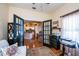 View from the office into kitchen, showing hardwood floors and modern fixtures at 1318 Red Oak Ln, Port Charlotte, FL 33948