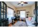 Bright office with natural light, hardwood floors, and stylish furniture at 1318 Red Oak Ln, Port Charlotte, FL 33948