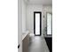 A modern bathroom with a glass shower stall, a wood-look vanity, and gray tiling at 13406 Chenille Dr, Port Charlotte, FL 33981