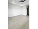Bright, spacious bedroom featuring neutral tile flooring, modern ceiling fan and recessed lighting at 13406 Chenille Dr, Port Charlotte, FL 33981