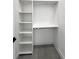 A walk-in closet with shelving and clothes rod at 13406 Chenille Dr, Port Charlotte, FL 33981
