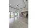 Bright living space showcasing tile flooring, recessed lighting, and a modern, open-concept design at 13406 Chenille Dr, Port Charlotte, FL 33981