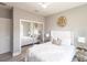 This bedroom features a mirrored closet, ceiling fan and contemporary decor at 14372 Tugwell Ave, Port Charlotte, FL 33953