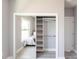Bedroom closet features mirrored sliding doors and modern shelving at 14372 Tugwell Ave, Port Charlotte, FL 33953