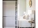 View of a well-organized closet with shelving and hanging space, adjacent to a bedroom at 14372 Tugwell Ave, Port Charlotte, FL 33953