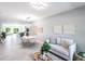 Open concept living room and dining area with modern lighting and decor with lots of space at 14372 Tugwell Ave, Port Charlotte, FL 33953