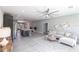 Open-concept living area featuring an island and comfortable seating, blending kitchen and living room spaces at 14372 Tugwell Ave, Port Charlotte, FL 33953