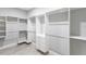 Spacious walk-in closet with custom shelving and drawers offers ample storage at 14372 Tugwell Ave, Port Charlotte, FL 33953