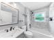 Bathroom featuring a tiled shower over tub, vanity, and modern fixtures at 1523 Napoleon Rd, North Port, FL 34288