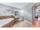 Bathroom featuring a soaking tub and vanity, leading to an adjacent bedroom at 1523 Napoleon Rd, North Port, FL 34288