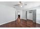 Bedroom with hardwood floors, closet, ceiling fan and view to living area at 1523 Napoleon Rd, North Port, FL 34288