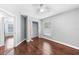 Bedroom with hardwood floors, window, closet and adjacent room at 1523 Napoleon Rd, North Port, FL 34288
