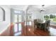 Spacious dining area with hardwood floors and modern chandelier at 1523 Napoleon Rd, North Port, FL 34288