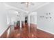 Spacious dining area with hardwood floors and modern chandelier at 1523 Napoleon Rd, North Port, FL 34288