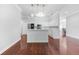 Kitchen with island, pendant lighting, and white cabinetry at 1523 Napoleon Rd, North Port, FL 34288