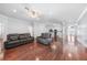 Open-concept living room with hardwood floors and a ceiling fan at 1523 Napoleon Rd, North Port, FL 34288