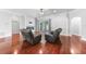 Bright living area with hardwood floors, fireplace and sliding door access to outdoor living at 1523 Napoleon Rd, North Port, FL 34288