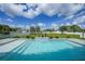 A beautiful pool with a waterfall feature and a spacious backyard at 1523 Napoleon Rd, North Port, FL 34288