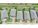 Aerial view of a neighborhood with well-maintained homes, driveways, and manicured lawns at 15261 Mille Fiore Blvd, Port Charlotte, FL 33953