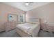 Bright bedroom with a queen-sized bed, stylish furniture, and a serene atmosphere at 15261 Mille Fiore Blvd, Port Charlotte, FL 33953