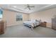 Inviting bedroom with a queen-sized bed, soft carpeting, and ample natural light at 15261 Mille Fiore Blvd, Port Charlotte, FL 33953