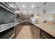 Modern kitchen with stainless steel appliances, granite countertops, and dark cabinets at 15261 Mille Fiore Blvd, Port Charlotte, FL 33953
