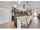 Modern kitchen with dark wood cabinets, stainless steel appliances, and granite countertops at 15261 Mille Fiore Blvd, Port Charlotte, FL 33953