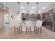 Spacious kitchen with stainless steel appliances, granite countertops, and a breakfast bar at 15261 Mille Fiore Blvd, Port Charlotte, FL 33953