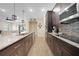Open kitchen featuring granite countertops, stainless steel appliances, and ample cabinet space at 15261 Mille Fiore Blvd, Port Charlotte, FL 33953