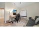 Multipurpose office featuring a couch, whiteboard, and a mounted monitor at 15261 Mille Fiore Blvd, Port Charlotte, FL 33953