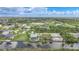 Expansive aerial view showcasing the community's layout, waterfront properties, and the lush landscape at 15652 Havana Cir, Port Charlotte, FL 33981