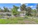 Lush backyard garden featuring a charming white gazebo surrounded by thriving plants and a serene atmosphere at 15652 Havana Cir, Port Charlotte, FL 33981
