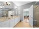 Elegant bathroom with double vanity, marble countertops, and walk-in shower at 15652 Havana Cir, Port Charlotte, FL 33981