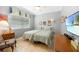 Bedroom with two twin beds, tile floors, and a ceiling fan at 15652 Havana Cir, Port Charlotte, FL 33981