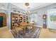 Traditional dining room with a chandelier, area rug and wooden furniture at 15652 Havana Cir, Port Charlotte, FL 33981