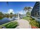 Brick pathway to the private dock and waterfront views at 15652 Havana Cir, Port Charlotte, FL 33981