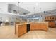 Open kitchen features ample counter space, wood cabinetry and modern appliances at 15652 Havana Cir, Port Charlotte, FL 33981