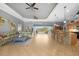 Open living area with kitchen bar, comfortable seating, and view to the pool at 15652 Havana Cir, Port Charlotte, FL 33981