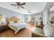 Serene main bedroom with sitting area, wood floors, and comfortable furniture at 15652 Havana Cir, Port Charlotte, FL 33981