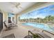 Inviting screened-in pool area with waterfront views and comfortable lounge seating at 15652 Havana Cir, Port Charlotte, FL 33981