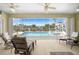 Inviting screened-in pool area with waterfront views and comfortable lounge seating at 15652 Havana Cir, Port Charlotte, FL 33981