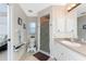 Bathroom with shower and matching commode and sink at 167 & 169 Marker Rd, Rotonda West, FL 33947