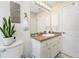 Bathroom with sink, vanity, garden themed decor, and tile flooring at 167 & 169 Marker Rd, Rotonda West, FL 33947
