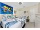 Bedroom with bed, closet, ceiling fan, and ocean themed decor at 167 & 169 Marker Rd, Rotonda West, FL 33947