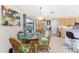 Dining area featuring a glass table and tropical-themed decor adjacent to kitchen at 167 & 169 Marker Rd, Rotonda West, FL 33947