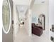 Warm and welcoming foyer with archways, tile flooring, and a comfortable sitting area at 167 & 169 Marker Rd, Rotonda West, FL 33947