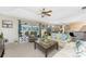 Living room with access to the kitchen, lanai, and tropical decor at 167 & 169 Marker Rd, Rotonda West, FL 33947