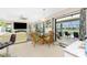 Inviting living area with a view of the pool, sliding doors and a dining space at 167 & 169 Marker Rd, Rotonda West, FL 33947